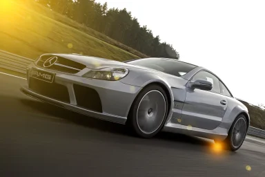 Mercedes-Benz SL 65 AMG in dynamischer Car-to-Car-Aufnahme auf einer Rennstrecke – Automobilfotografie von Dieter Rebmann.