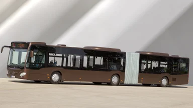 Brauner Mercedes-Benz Citaro Gelenkbus steht vor einer modernen architektonischen Kulisse.